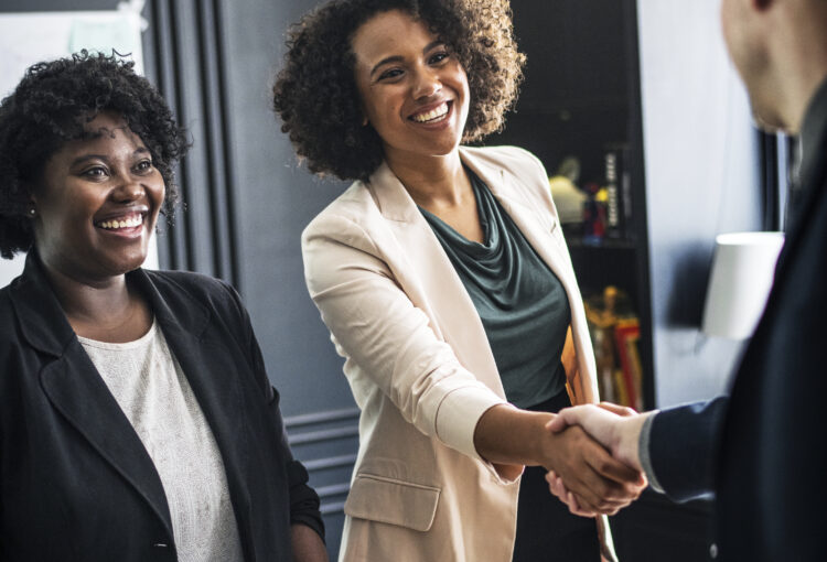 Business partners shaking hands in agreement